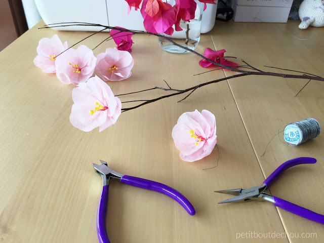 plum blossom flowers and branch with wire