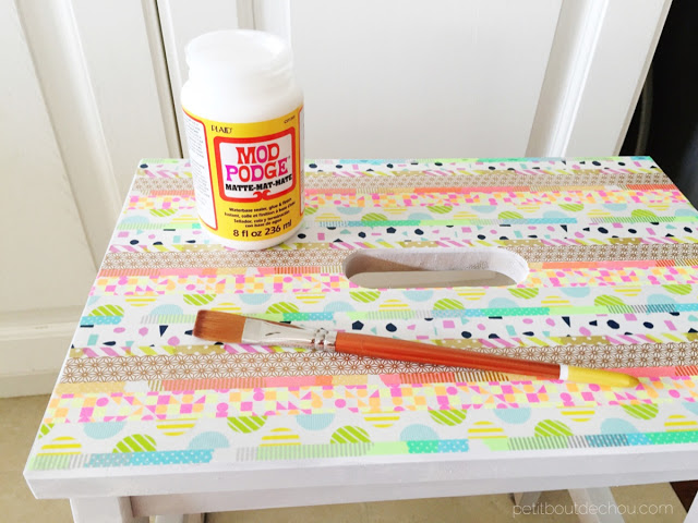 apply mod podge to seal washi tape on step stool