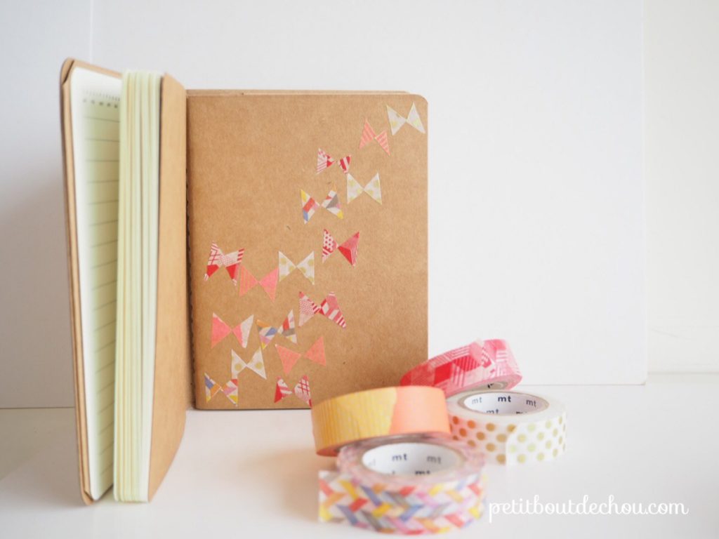 notebook decorated with masking tape butterflies